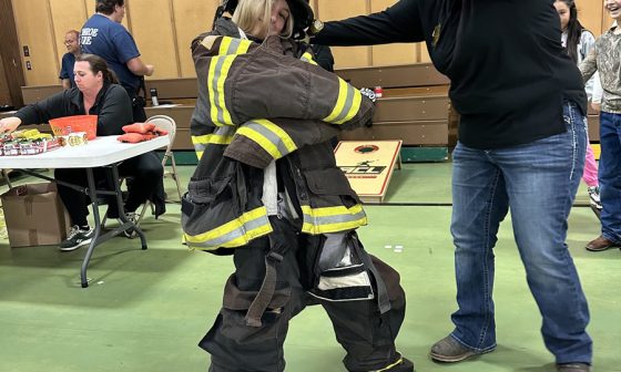 Health Fair Fun: Kids Suit Up in Firefighter Gear!