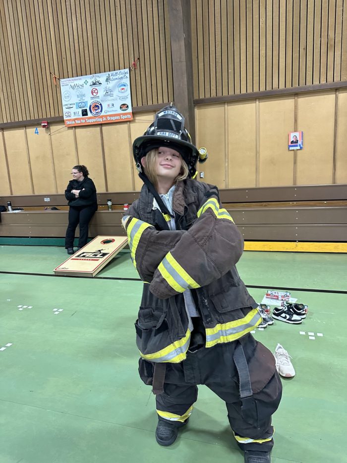 kids trying on firefighter gear